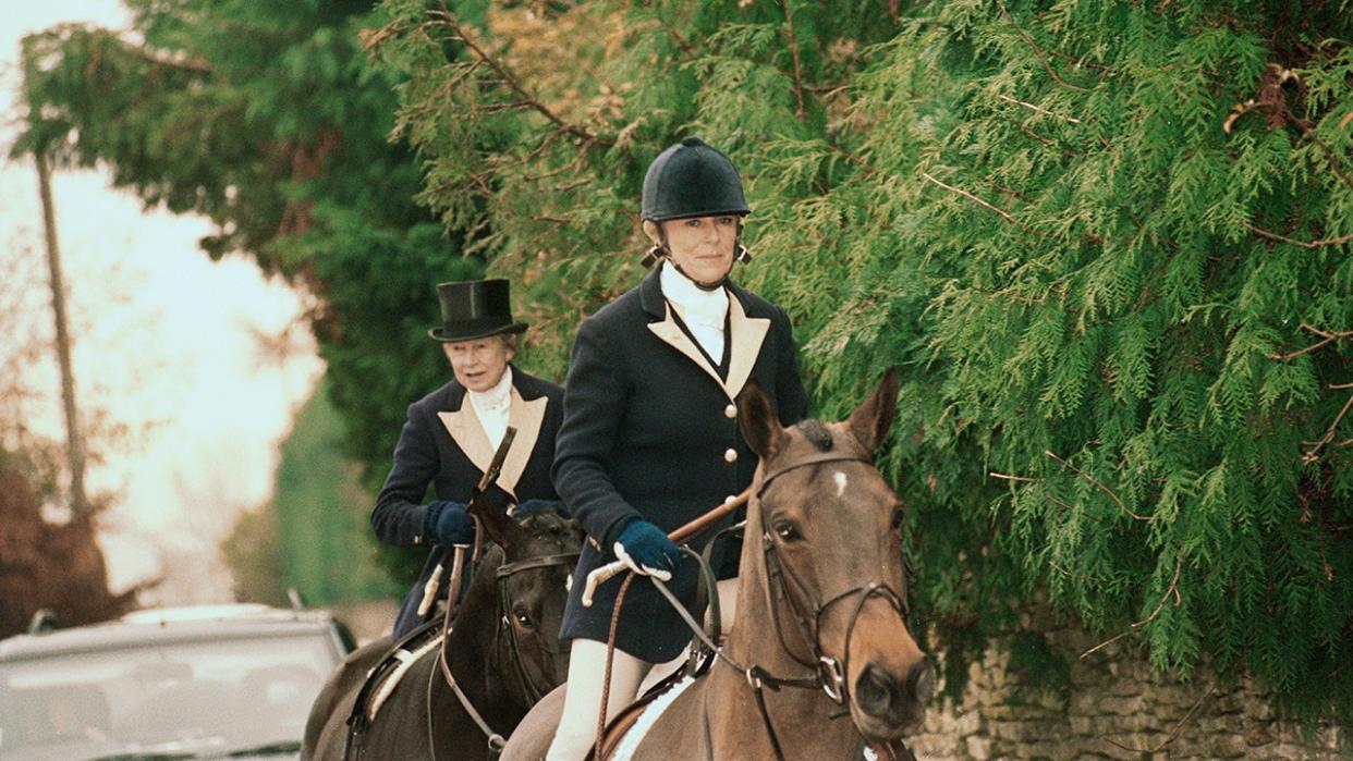 Camilla riding a horse.