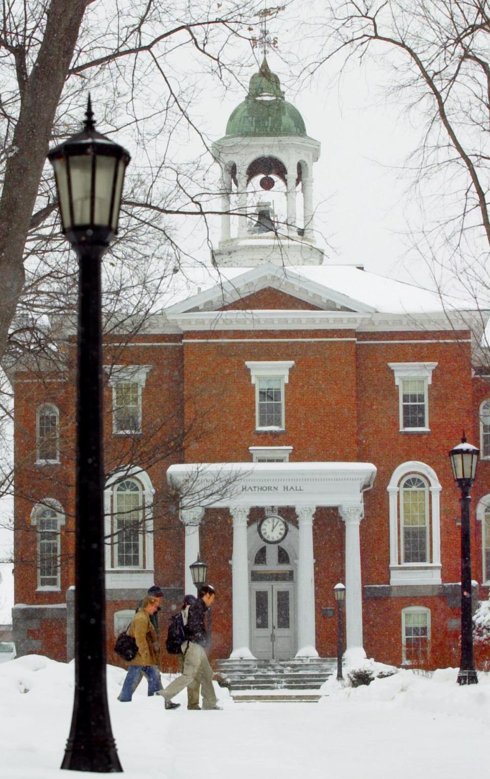 Students make their way across campus past Hathorn Hall during a snow storm at Bates College in Lewiston, Maine, March 1, 2005.