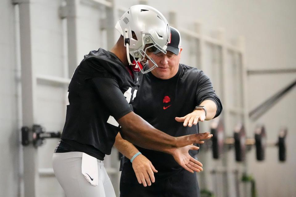 Mar 5, 2024; Columbus, OH, USA; Ohio State Buckeyes offensive coordinator Chip Kelly works with quarterback Air Noland during the first spring practice at the Woody Hayes Athletic Center.