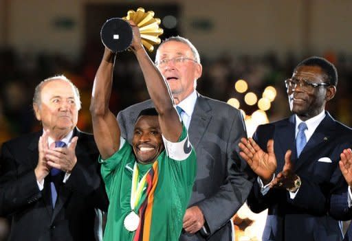 Christopher Katongo holds up the 2012 African Cup of Nations trophy after the in Libreville in February 2012. Katongo scored midway through the first half to give title holders Zambia a 1-0 first-leg lead over Uganda Saturday in a 2013 Africa Cup of Nations qualifier