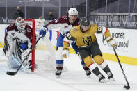 Vegas Golden Knights center Jonathan Marchessault (81) skates around Colorado Avalanche defenseman Samuel Girard (49) during the second period of an NHL hockey game Wednesday, April 28, 2021, in Las Vegas. (AP Photo/John Locher)