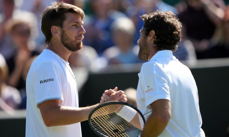 Cameron Norrie (left) shakes hands with Pablo Andújar after their first-round match