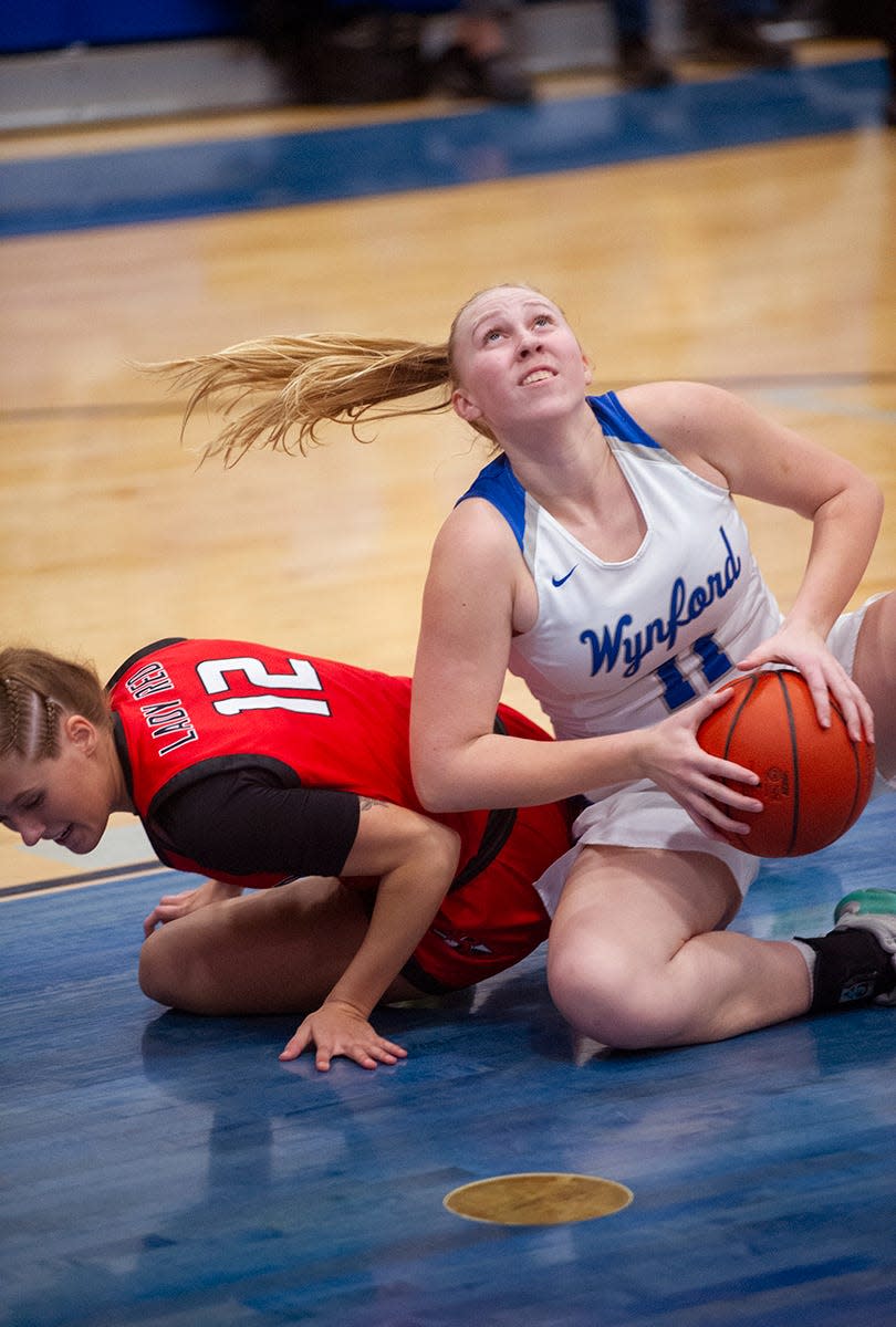 Wynford's Brooke Frombaugh grabs a loose ball away from Bucyrus' Addison Kemery.