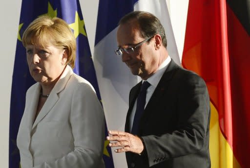 This file photo shows German Chancellor Angela Merkel and French President Francois Hollande, in Berlin, on August 23. The leaders of France and Germany meet on Saturday to mark a seminal 1962 speech by Charles de Gaulle, with the euro crisis and a proposed EADS-BAE merger also on the agenda