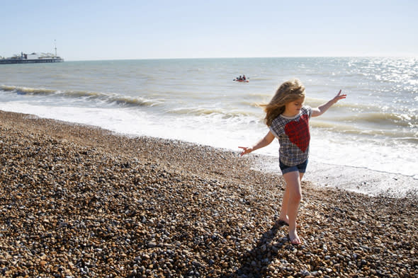 Mandatory Credit: Photo by London News Pictures/REX (3654721b) People enjoying the sunshine and warm weather on Brighton Beach Warm Spring Weather, Brighton, Britain - 16 Mar 2014  