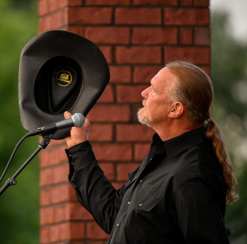 Trace Adkins holds his hat up during a public memorial service for Charlie Daniels outside of Sellars Funeral Home in Mt. Juliet, Tenn., Wednesday, July 8, 2020.