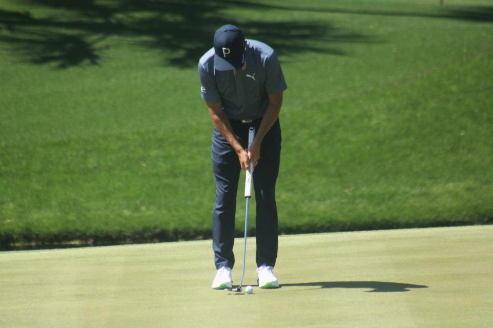 Rickie Fowler putts on the 12th green of the Players Stadium Course during a practice round on March 12.