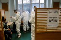 A student of the Emile Dubois high school takes part to a COVID-19 antigen test in Paris, Monday Nov. 23, 2020. Experts said they are less accurate than the standard PCR test, which detects even the tiniest genetic trace of the virus. Many governments including in France have started deploying them as a precursor to PCR tests.( Ludovic Marin, Pool via AP)