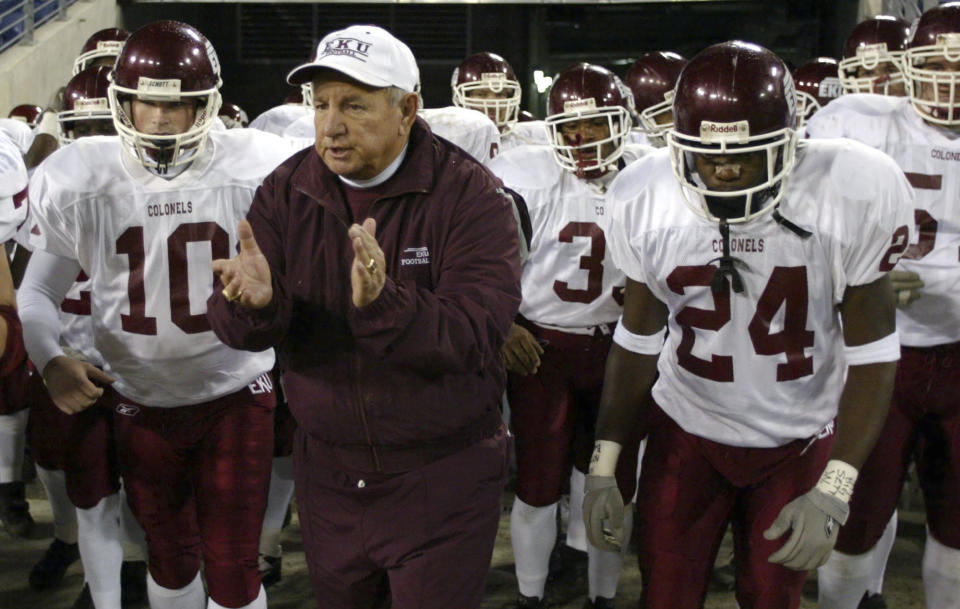 FILE - Eastern Kentucky University NCAA college football head coach Roy Kidd leads his team onto the field before a game against Tennessee State during his last game coaching, in Nashville, Tenn., Nov. 21, 2002. Kidd, who coached Eastern Kentucky to two NCAA Division I-AA football championships in a Hall of Fame career, has died. He was 91. The school announced Kidd’s death on Tuesday, Sept. 12, 2023, in a release after being informed by the family. ( AP Photo/Neil Brake, File)