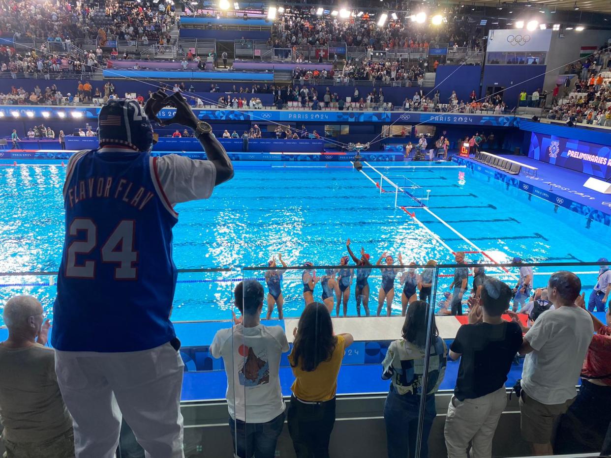 Flavor Flav cheers on the U.S. women's water polo team in their first game of these Olympics. (Yahoo Sports)