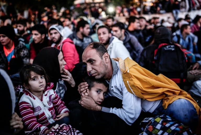 Migrants and refugees wait at Istanbul's Esenler bus terminal for buses to the Turkish-Greek border after authorities withheld tickets to Turkish border towns on September 16, 2015