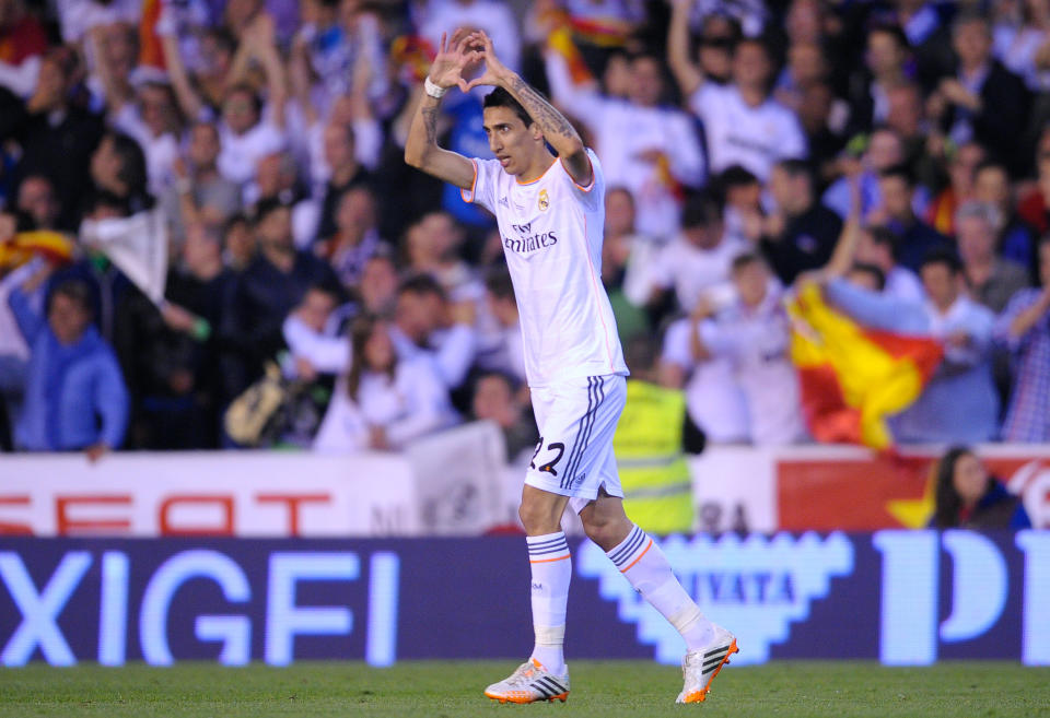 Real's Angel Di Maria celebrates after scoring the opening goal during the final of the Copa del Rey between FC Barcelona and Real Madrid at the Mestalla stadium in Valencia, Spain, Wednesday, April 16, 2014. (AP Photo/Manu Fernandez)