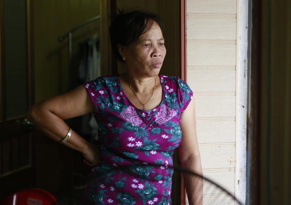 Nguyen Thi Vy, step mother of Doan Thi Huong, looks out at her house in Nghia Binh village, Nam Dinh province, Vietnam, Thursday, Aug. 16, 2018. Doan and Indonesian Siti Aisyah, who are on trial in the assassination of the North Korean leader's half brother have told the court they will testify in their defense. The women are accused of smearing VX nerve agent on Kim Jong Nam's face last year. They have said they thought it was a prank. A judge ruled Thursday the women should begin entering their defense.(AP Photo/ Hau Dinh)