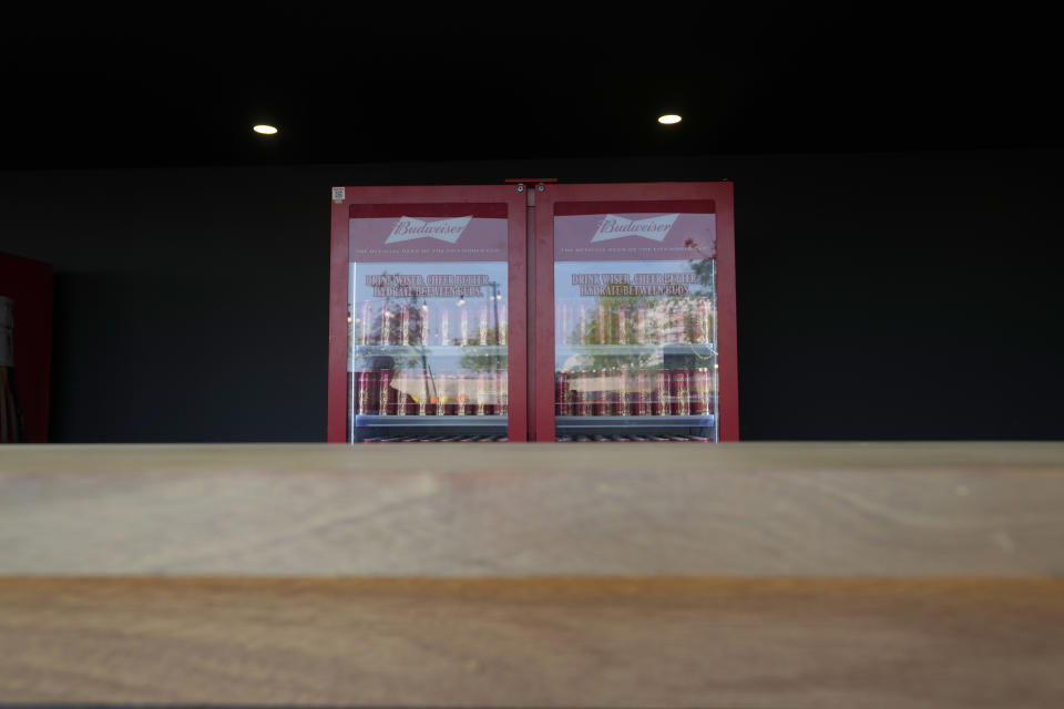 Cans of beers are displayed for sale at the World Cup main media center in Doha, Qatar, Friday, Nov. 18, 2022. The sale of all beer with alcohol at the eight World Cup stadiums has been banned. The decision comes only two days before the soccer tournament is set to start. Non-alcoholic beer will still be available for fans at the 64 matches. FIFA says the decision was made "following discussions between host country authorities and FIFA." Champagne, wine, whiskey and other alcohol is still expected to be served in the luxury hospitality areas of the stadiums. (AP Photo/Hassan Ammar)