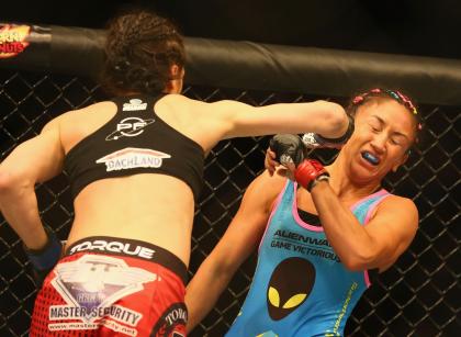 Joanna Jedrzejczyk punches Carla Esparza during their women's strawweight title fight on March 14. (Getty)