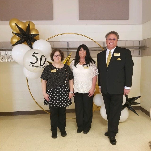 Valerie Wray and Rhonda Foraker, administration staff with Shon Gress, director of the Guernsey County Senior Center