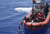 In this Tuesday, May 14, 2019, photo provided by the Philippine Coast Guard, the American Coast Guard conducts joint search and rescue exercises with their Philippine counterparts off the South China Sea west of the Philippines. Captain John Driscoll, commanding officer of the U.S. Coast Guard National Security Cutter Bertholf (WMSL 750), told reporters Wednesday, May 15, 2019, two Chinese Coast Guard ships were spotted off the South China Sea while they were conducting the joint exercise with Philippine Coast Guard. (Philippine Coast Guard Via AP)