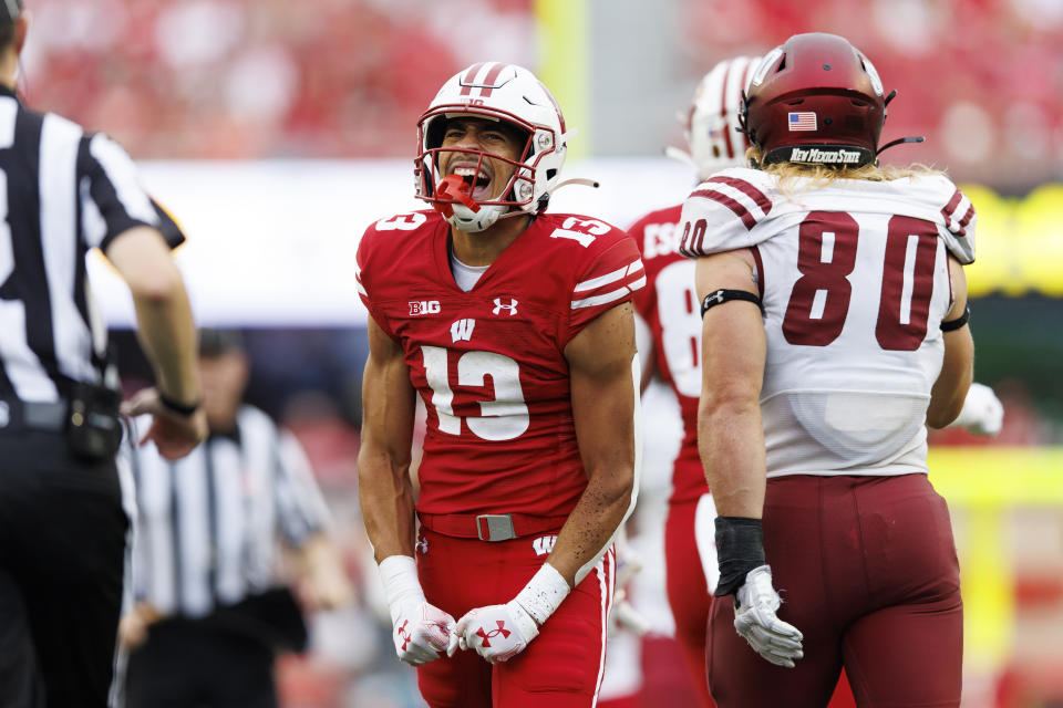 Sep 17, 2022; Madison, Wisconsin, USA; Wisconsin Badgers wide receiver Chimere Dike (13) reacts after catching a pass during the third quarter against the New Mexico State Aggies at Camp Randall Stadium. Mandatory Credit: Jeff Hanisch-USA TODAY Sports