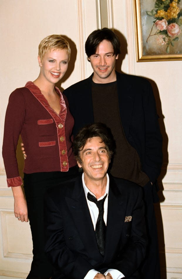 Charlize Theron, Al Pacino and <a href="https://parade.com/1094493/jessicasager/keanu-reeves-girlfriend-married-wife/" rel="nofollow noopener" target="_blank" data-ylk="slk:Keanu Reeves;elm:context_link;itc:0;sec:content-canvas" class="link ">Keanu Reeves</a> attend a photocall for their film "The Devil's Advocate."<p><a href="https://www.gettyimages.com/detail/667968092" rel="nofollow noopener" target="_blank" data-ylk="slk:Eric Robert/Getty Images;elm:context_link;itc:0;sec:content-canvas" class="link ">Eric Robert/Getty Images</a></p>