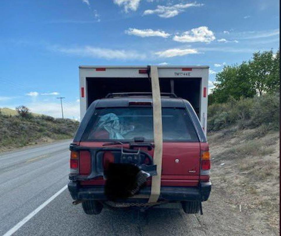Washington State Patrol Trooper John Bryant posted this photo a U-Haul driver with a SUV loaded in the back.