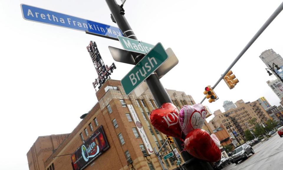 Balloons hang in honor on a street post at Aretha Franklin Way in Detroit.