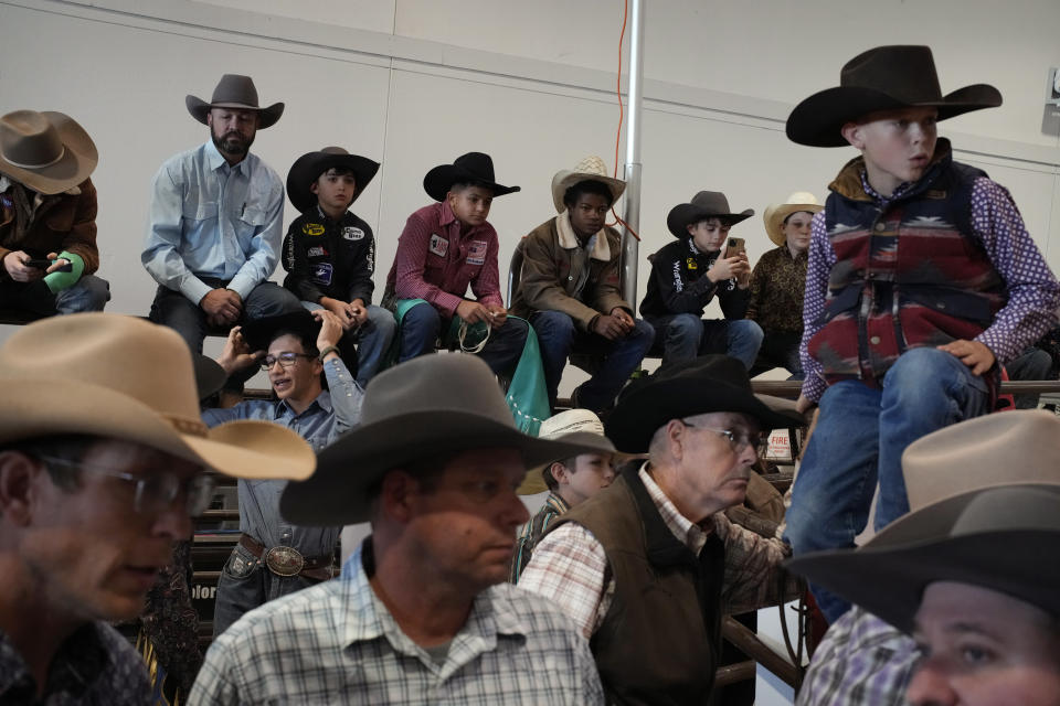 People watch the bull riding event during the Junior World Finals rodeo, Thursday, Dec. 7, 2023, in Las Vegas. (AP Photo/John Locher)