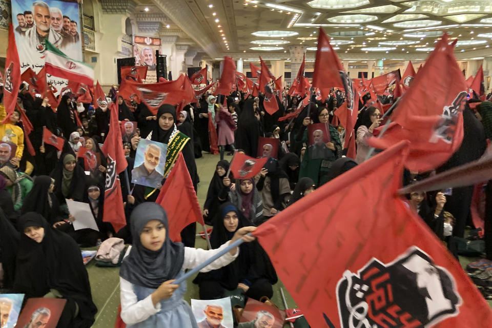 People attend a commemoration for the late Revolutionary Guard Gen. Qassem Soleimani, who was killed in a U.S drone attack in 2020 in Iraq, at the Imam Khomeini grand mosque in Tehran, Iran, Wednesday, Jan. 3, 2024. Iran says bomb blasts at an event in the city of Kerman, honoring a prominent Iranian general slain in a U.S. airstrike in 2020, have killed at least 103 people and wounded 188 others. (AP Photo/Vahid Salemi)