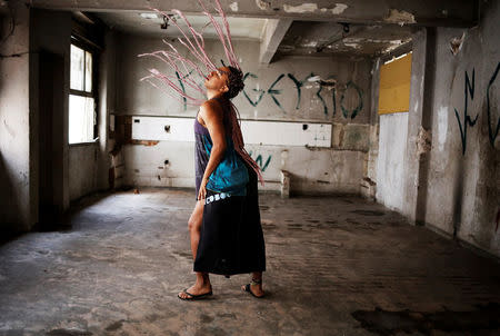 Manauara, 24, who is among members of lesbian, gay, bisexual and transgender (LGBT) community, that have been invited to live in a building that the roofless movement has occupied, poses for a portrait, in downtown Sao Paulo, Brazil, November 26, 2016. REUTERS/Nacho Doce