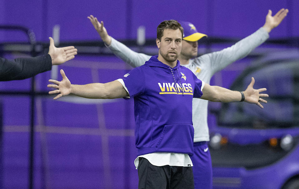 FILE - In this April 16, 2019, file photo, Minnesota Vikings wide receiver Adam Thielen stretches before practice at the Twin Cities Orthopedic Center in Eagan, Minn. The Chicago Bears, Tennessee Titans and Los Angeles Rams all decided to end their offseason programs even with the NFL allowing two more weeks to keep working. So did the Houston Texans, Arizona Cardinals and Washington Redskins. Turns out there's only so much that can be done virtually. (Elizabeth Flores/Star Tribune via AP, File)