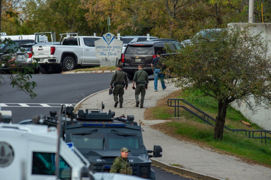 Law enforcement officers gather outside Lewiston High School, Maine on October 26, 2023. A massive manhunt was under way on October 26 for a gunman who a local official said killed at least 22 people and wounded dozens more in mass shootings in the US state of Maine, the deadliest such incident this year. (Photo by Joseph Prezioso / AFP) (Photo by JOSEPH PREZIOSO/AFP via Getty Images)