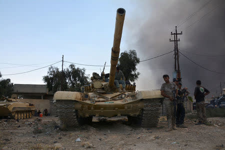 A tank of the Iraqi army is seen in the town of Qayyara, Iraq. REUTERS/Stringer