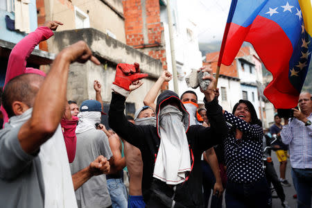 Demonstrators take part in a protest close to an outpost of the Venezuelan National Guard in Caracas, Venezuela January 21, 2019. REUTERS/Carlos Garcia Rawlins