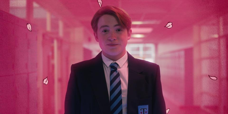 a person wearing a school uniform with a striped tie, standing in a hallway with pink petals floating around