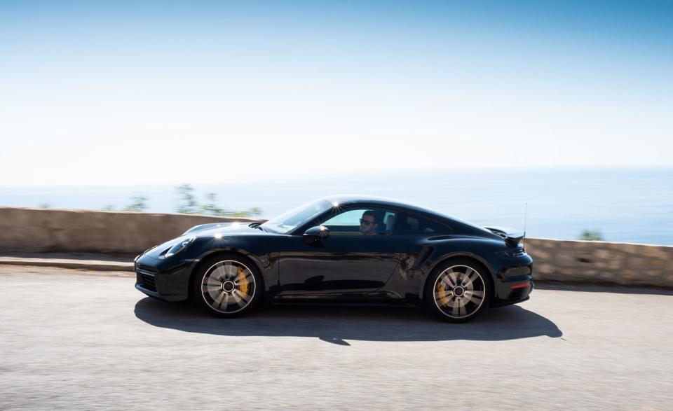 <p>Porsche's carbon-ceramic brake rotors with 10-piston front brake calipers are standard on the Turbo S. </p>