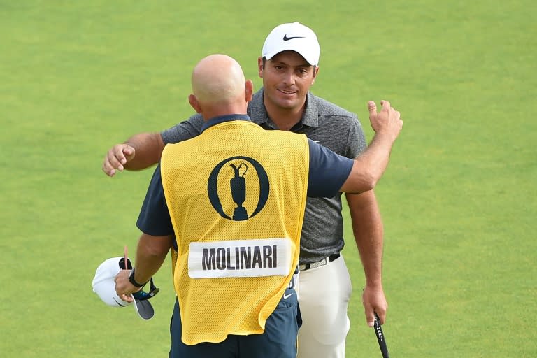 Francesco Molinari embraces his caddie on the 18th green at the end of his final round at Carnoustie on Sunday