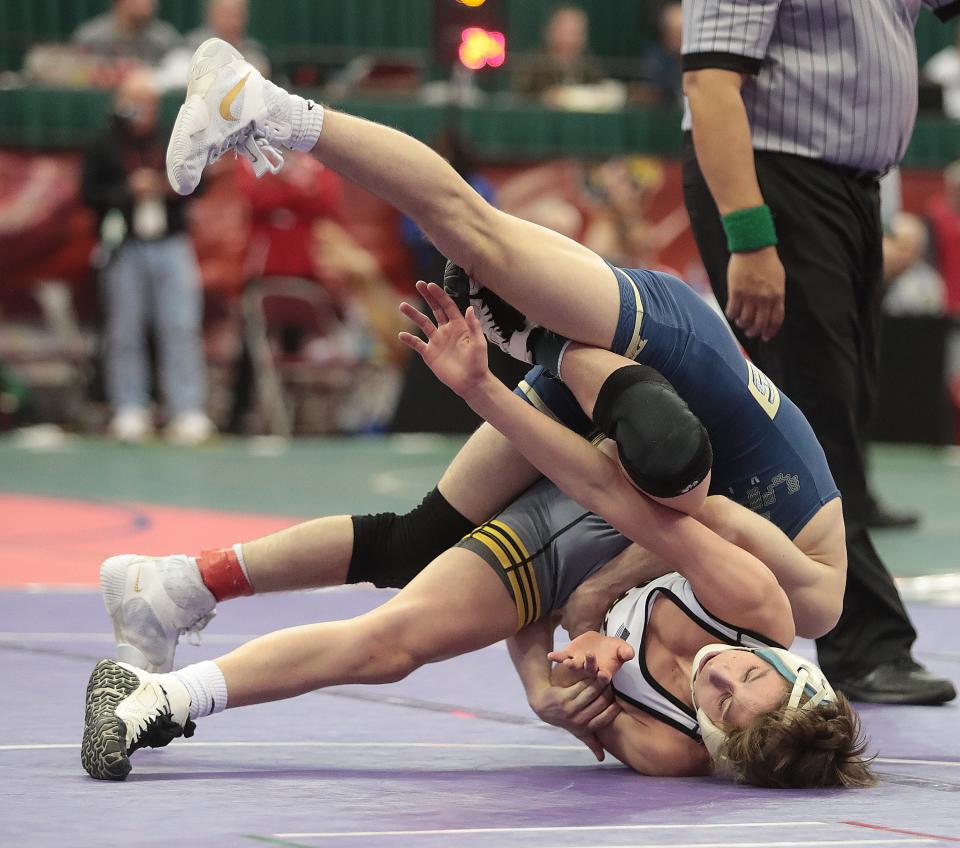 Perry's Emeric McBurney wrestles Brett Stanley of Brecksville  in the 106 pound weight class during Sundays consolation finals class  at the OHSAA State Wrestling tournament. 