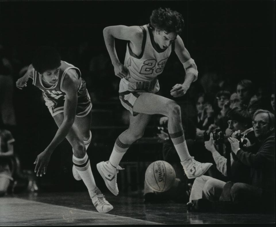 Jim Boylan (right) tries to avoid a ball headed out of bounds in 1978.