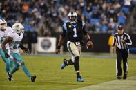 Nov 13, 2017; Charlotte, NC, USA; Carolina Panthers quarterback Cam Newton (1) runs as Miami Dolphins strong safety Nate Allen (29) defends in the third quarter at Bank of America Stadium. Bob Donnan-USA TODAY Sports