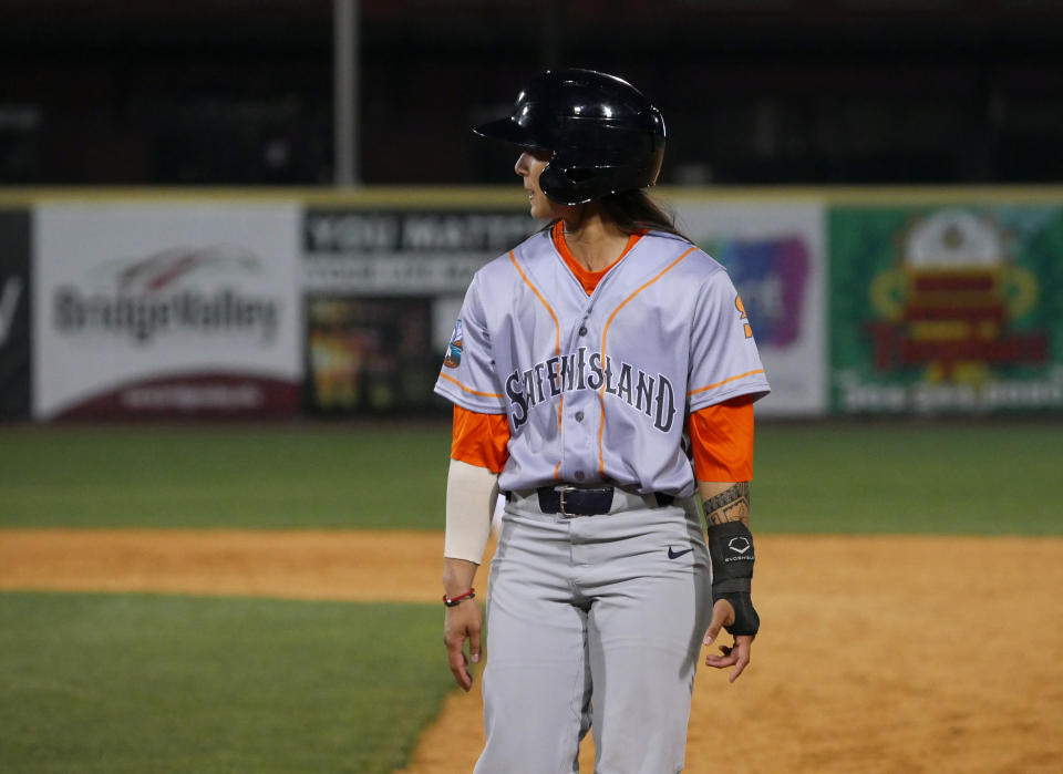 In this photo provided by Joseph Langan, pinch-runner Kelsie Whitmore walks back to first during the team's baseball game against the Charleston Dirty Birds on Thursday, April 21, 2022, in Charleston, W.Va. Whitmore played left field and batted ninth for the FerryHawks in Gastonia, N.C., Sunday, May 1, 2022, becoming the first woman to start a game in the Atlantic League and one of the first to do so in a league connected to Major League Baseball. (Joseph Langan via AP)