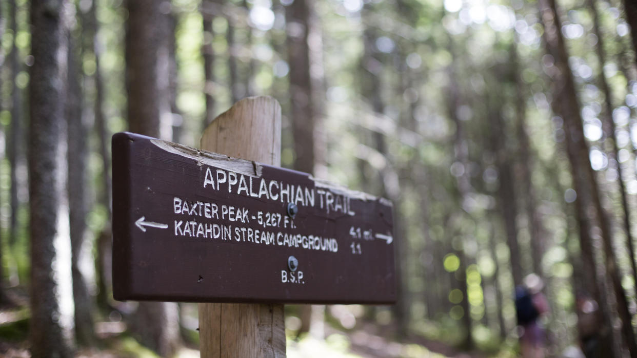  A sign on the Appalachian Trail points hikers to Mt Katahdin in Maine. 