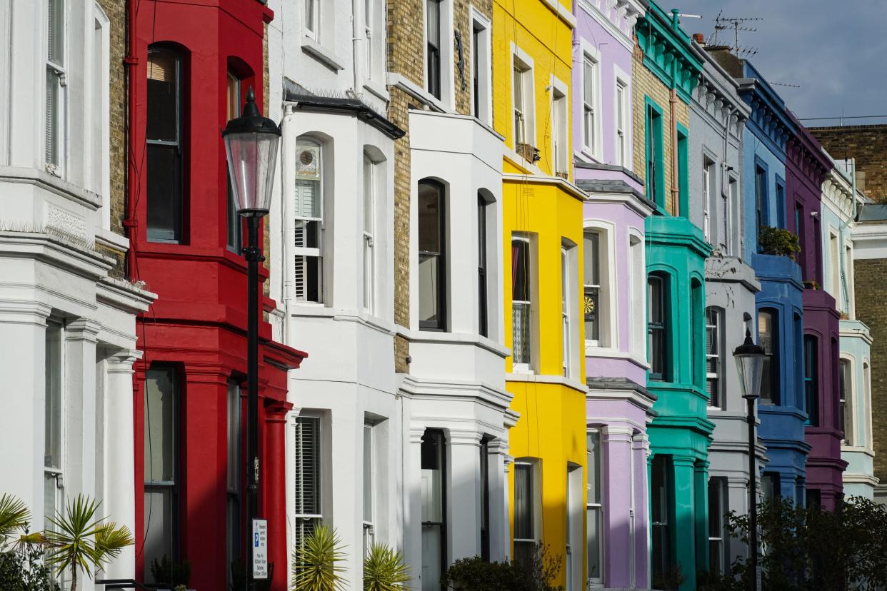 Mortgage Colorful terrace houses on residential street in Notting Hill, London, England United Kingdom UK