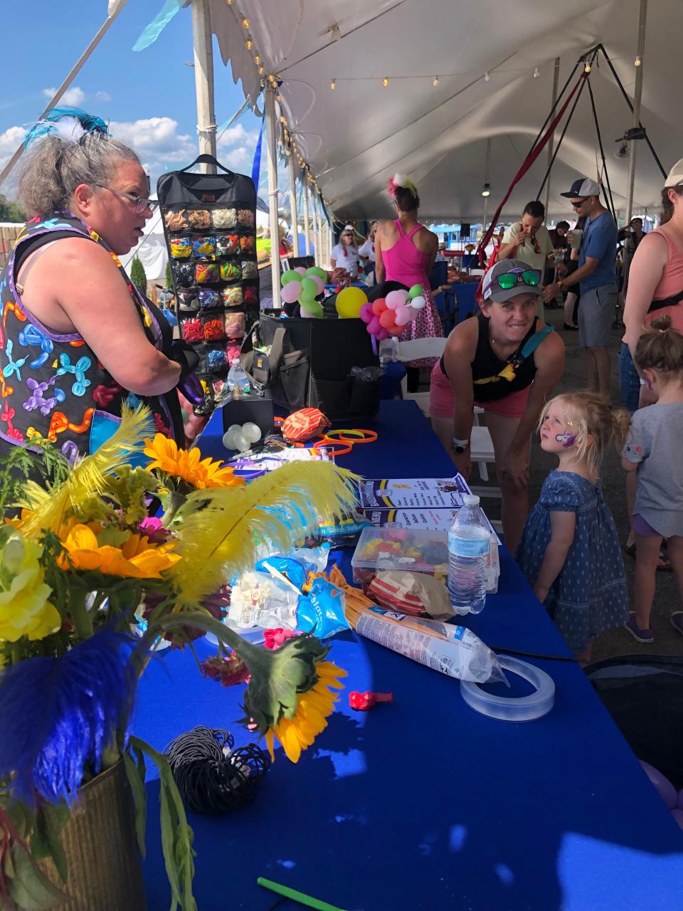 The first Little Italy Carnival on Sunday, Aug. 6, 2023 in Portsmouth featured many activities, free toys, candy and other giveaways for children. Above is the face painting and balloon animal station in the Boston Circus Guild tent.