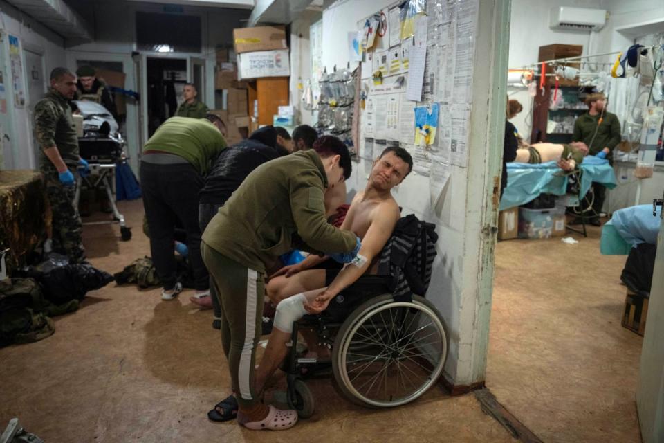 Military medics give first aid to wounded Ukrainian soldiers near Bakhmut, Ukraine (Copyright 2024 The Associated Press. All rights reserved)