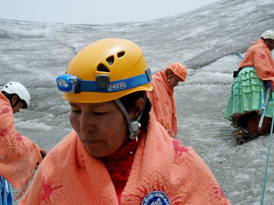 A photo of an Aymaran woman in a helmet.