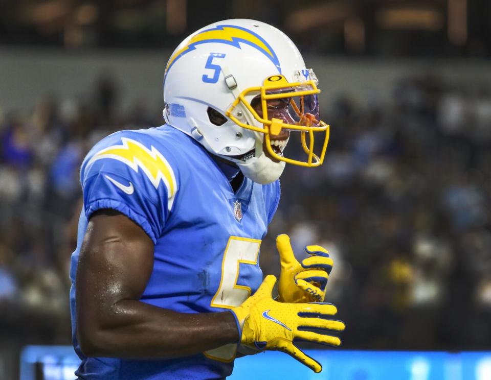 Chargers wide receiver Joshua Palmer opens his mouth in celebration of his touchdown.