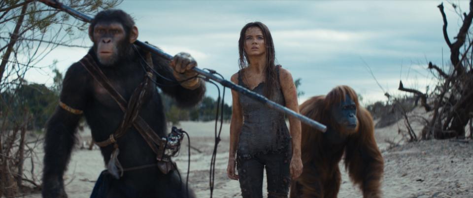 From left, Noa (played by Owen Teague), Nova (played by Freya Allan) and Raka (played by Peter Macon) in 20th Century Studios' "Kingdom of the Planet of the Apes."