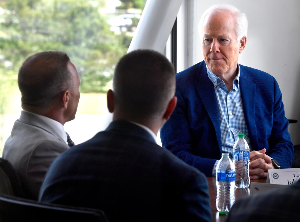 U.S. Sen. John Cornyn listens to Abilene Christian University President Phil Schubert (left) during a briefing Tuesday at the  Nuclear Energy eXperimental Testing Lab on the school’s future molten salt nuclear research reactor.