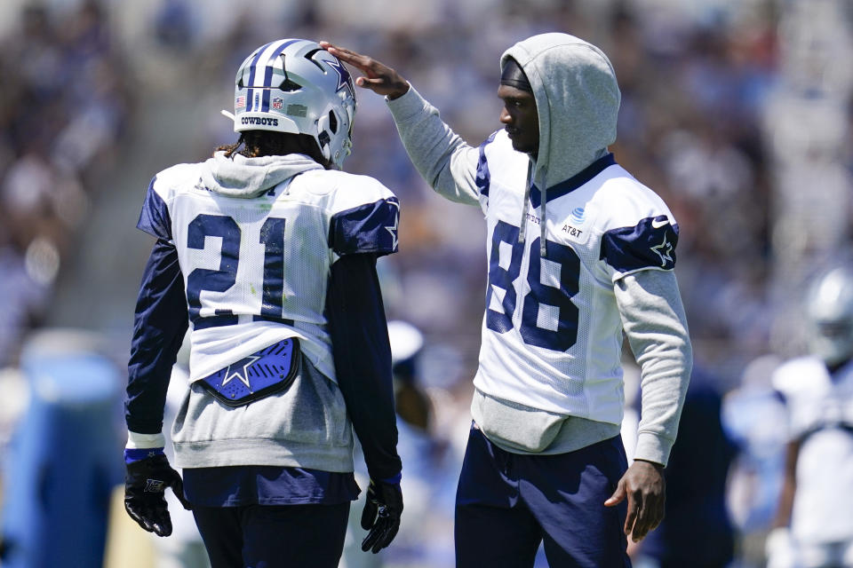 Dallas Cowboys running back Ezekiel Elliott (21) and wide receiver CeeDee Lamb (88) participate in drills during a combined NFL practice at the Los Angeles Rams' practice facility in Costa Mesa, Calif. Wednesday, Aug. 17, 2022. (AP Photo/Ashley Landis)