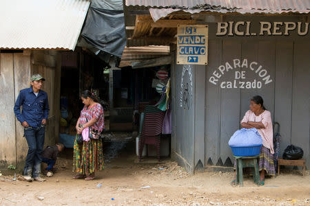 A woman sells corn bread in the village where Jakelin, a 7-year-old girl who died in U.S. custody, used to live in Raxruha, Guatemala December 15, 2018. REUTERS/Josue Decavele