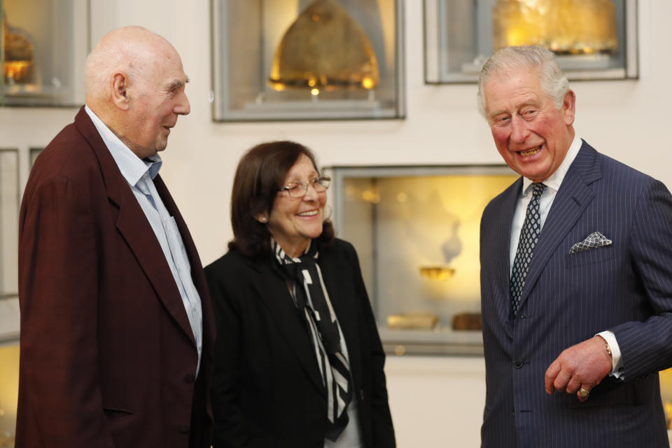 Britain's Prince Charles, right, greets Holocaust survivor Marta Wise, center, and George Shefi, whose mother perished at Auschwitz, during a reception at the Israel Museum in Jerusalem, Thursday, Jan. 23, 2020. (AP Photo/Frank Augstein, Pool)